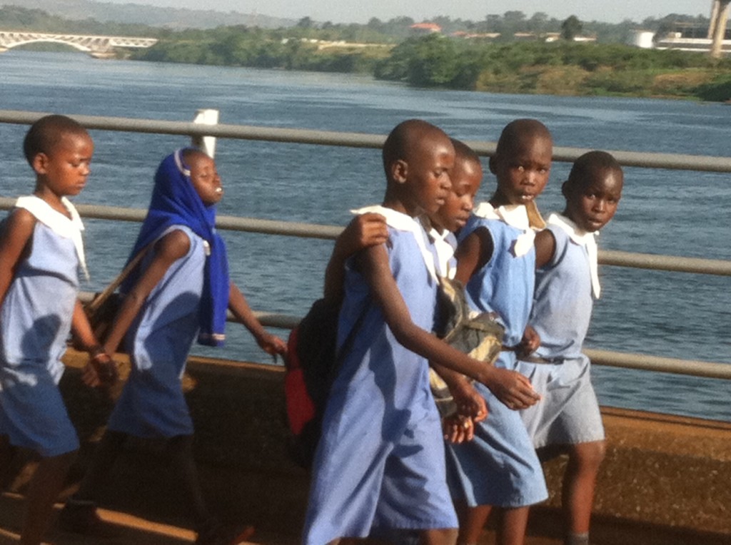 School children walking across the Nile River bridge